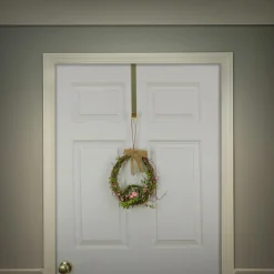 National Tree Company 11 in. Easter Bird's Nest Hanging Wall Decoration Decorated with Leafy Greens and Pastel Eggs