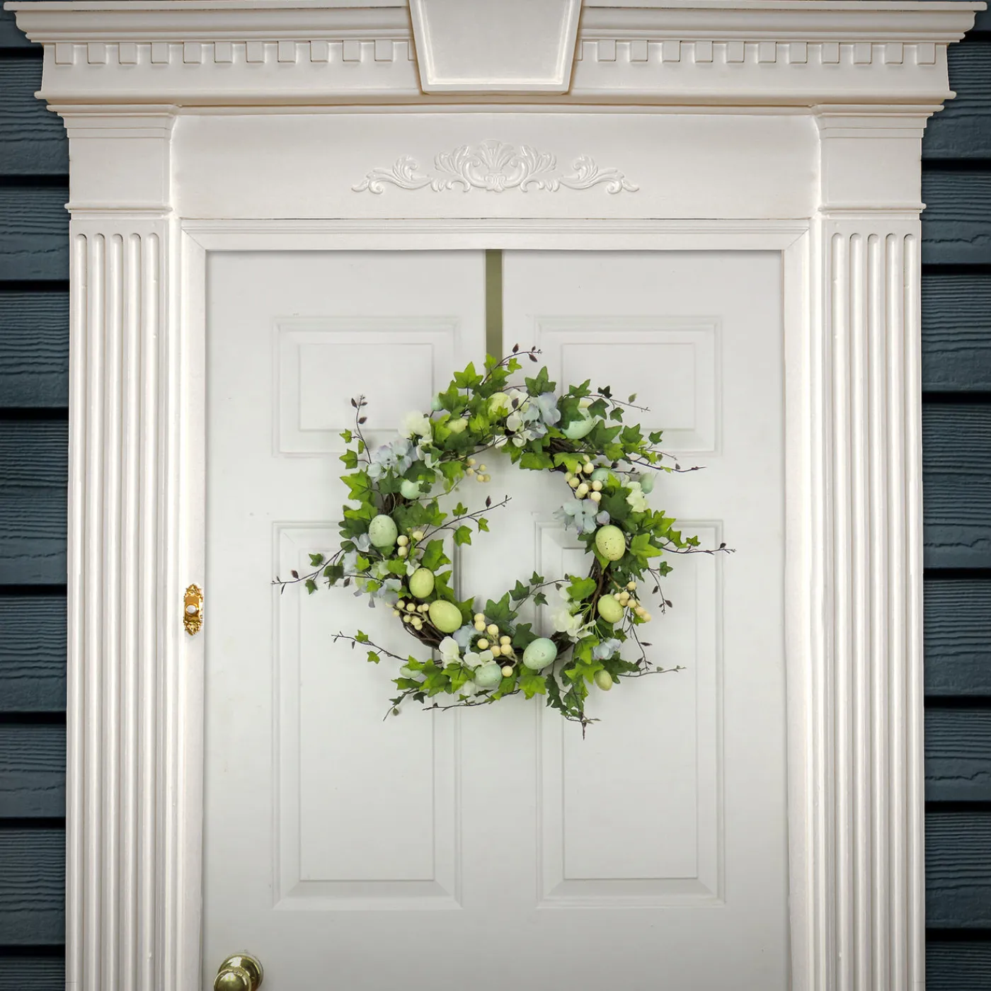 National Tree Company 22 in. Easter Wreath Decorated with Pastel Eggs, Blue Flowers