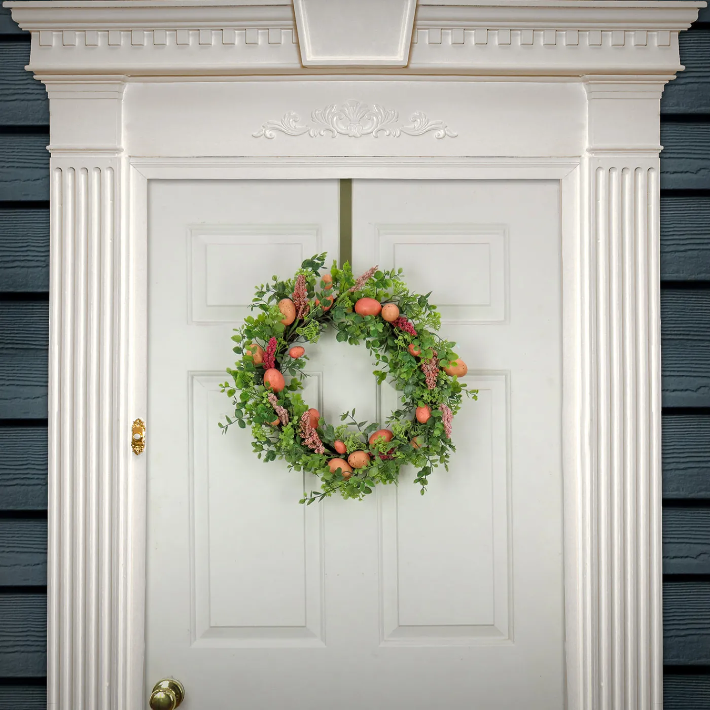 National Tree Company 22 in. Easter Wreath Decorated with Pink Pastel Eggs, Pink Flowers, Leafy Greens