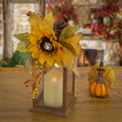 National Tree Company 14 in. Fall Lantern with Sunflower, Mixed Leaves, Pinecone and Bow