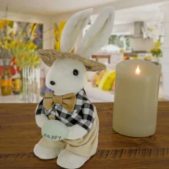 National Tree Company 12 in. Fluffy Bowtie Male Easter Bunny Holding Easter Egg Table Decoration