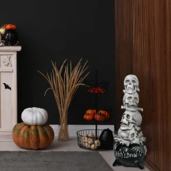 National Tree Company 38 in. Halloween Stacked Skulls in a Cauldron Tabletop Decoration