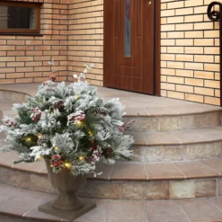 National Tree Company 22 in. Pre-Lit Snowy Bedford Urn Filler with LED Lights