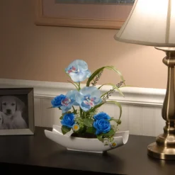 National Tree Company 15 in. Spring Potted White Orchid and Blue Roses Flower Pot with Leafy Greens