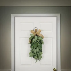 National Tree Company 26 in. Spring Teardrop Wall Hanging Decoration with Eucalyptus Leaves, Magnolia Blooms, Flowing Green Stems
